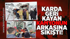 Karda geri kayan çöp kamyonun arkasına sıkıştı!