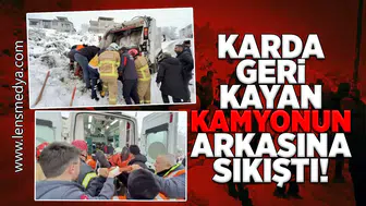 Karda geri kayan çöp kamyonun arkasına sıkıştı!
