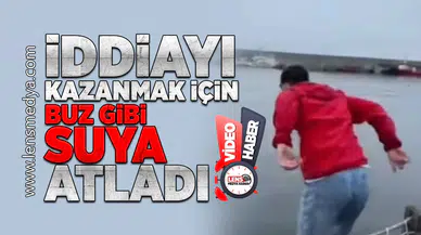 İddiayı kazanmak için buz gibi suya atladı!