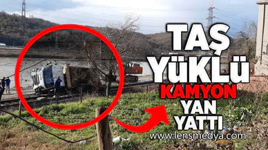 Taş yüklü kamyon yan yattı!