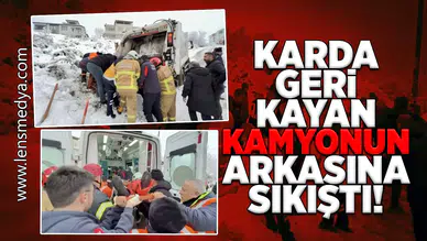 Karda geri kayan çöp kamyonun arkasına sıkıştı!